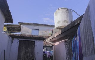 white concrete water tank on roof