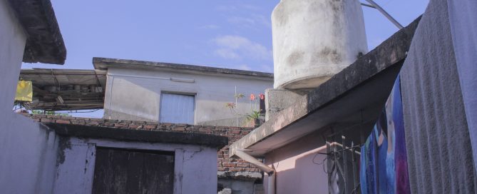 white concrete water tank on roof